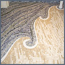 wave mosaic spilling out of shower
